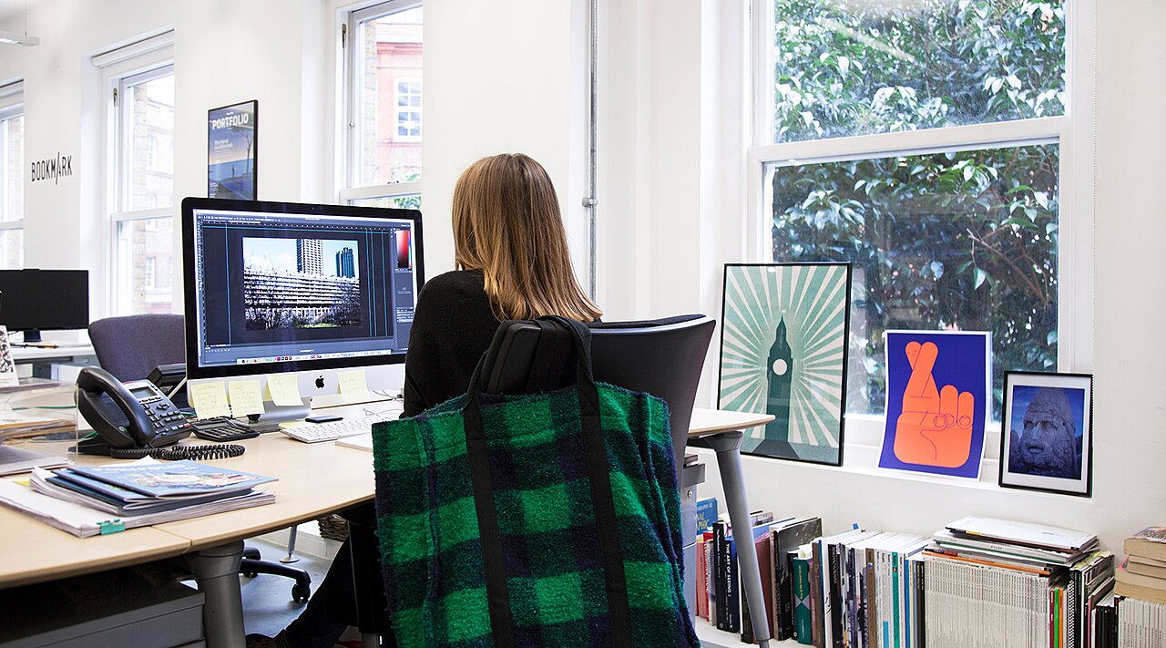 Analyst working at a desktop computer in an office